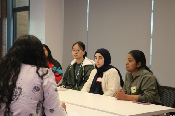 Loralee speaking to scholars
