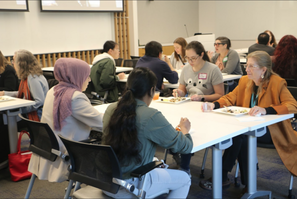 professors and students conversing